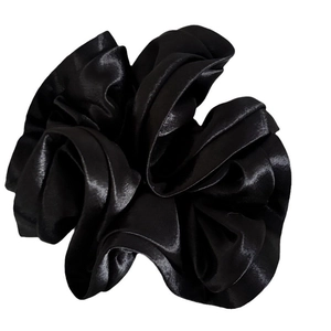 Elegant black satin ruffle scrunchie with silk texture and glossy finish for hair