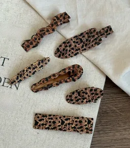 Close-up of a 6-piece leopard print hair clip set with acetate texture details