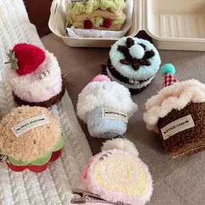 Plush dessert hair clips featuring strawberry cake and burger shapes on soft background