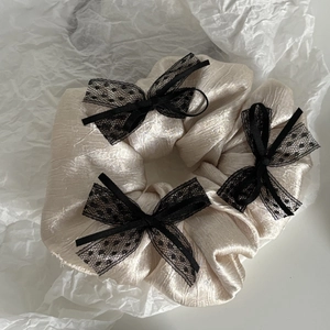 Elegant beige satin scrunchie with three black lace bows in French vintage style