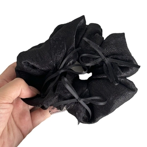 Elegant French black satin scrunchie with lace trim and delicate bow detail