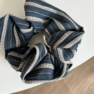 Navy and beige striped scrunchie made of soft pleated cotton fabric for daily hairstyling