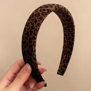 Fashionable leopard print velvet headband with thick padded design for a high top hairstyle