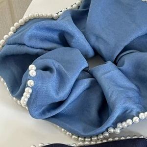 Blue denim style satin scrunchie with white pearl trim and elegant pleated texture