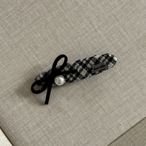 Detail of checkered hair clip with black velvet bow and pearl, France Handmade mark
