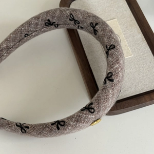 French style tweed padded headband with black embroidery bows and gold metal plaque
