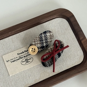 British style plaid hair clip set with wooden button and bow on linen tray