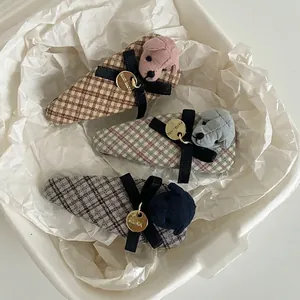 Three-piece set of plaid fabric hair clips with plush dog charms and silk bows