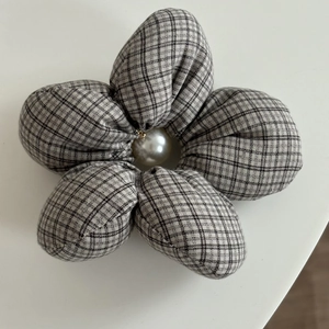 Plaid flower hair scrunchie with a large white pearl center for elegant hair styling