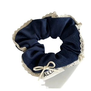 Navy blue plaid scrunchie with cream lace trim and elegant white bow decoration