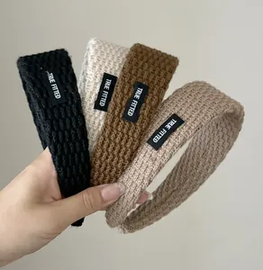Detailed knitted texture of sporty wide headbands with True Fitted label in 4 colors
