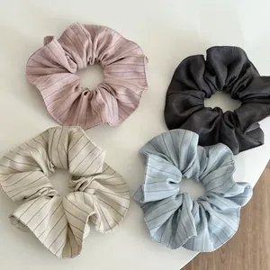 Minimalist striped hair scrunchies set in pink grey beige and blue colors