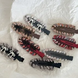 French style knitted acetate hair clip with bow accents in various colors on white background