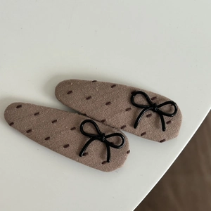 Set of 2 khaki fabric hair clips with black bow decor and stitch embroidery
