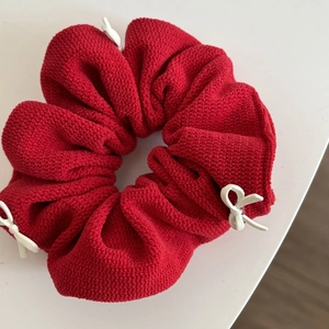 Elegant red oversized scrunchie with three white 3D bows in soft knit fabric