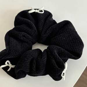 Elegant black knitted hair scrunchie with white bow charms for women high ponytail style