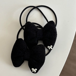 Set of two black knitted bow hair ties with delicate white butterfly accents