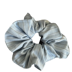 Blue striped oversized fabric scrunchie with cotton texture for elegant hair styling