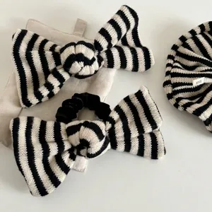 Chic black and white striped knit bow hair accessories set including headband and scrunchie