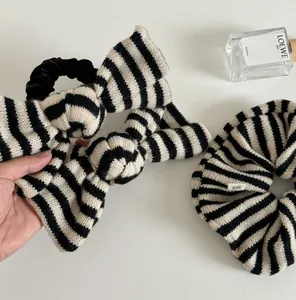 Detail of hand made label on striped knitted bow hair accessories set