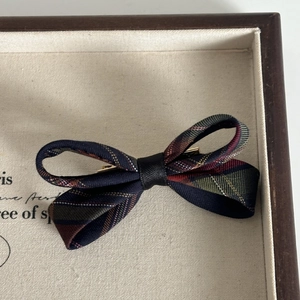 Navy blue plaid bow hair clip with British style tartan pattern and metal duckbill clip