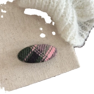 Classic pink and green plaid tweed hair clip with retro checkered fabric texture