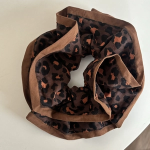 Brown leopard print scrunchie with dark brown fabric edging for women hair accessories