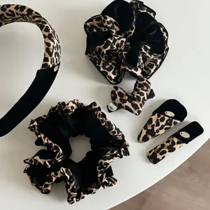 French velvet leopard print hair accessories set including headband, scrunchie and hair clips
