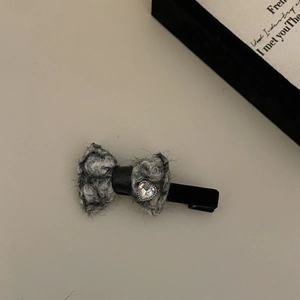 Cute Korean style plush grey bow hair clip with a sparkling heart rhinestone center