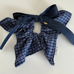 Vintage blue checkered bow scrunchie with denim texture and gold metal logo charm