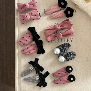 Assortiment détaillé de barrettes à pois en velours côtelé et nœuds pour femmes