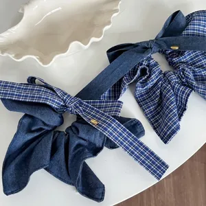 Deep blue denim and blue-white plaid oversized bow scrunchie with gold metal emblem