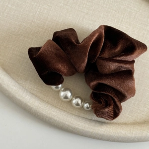 Elegant brown velvet scrunchie with vertical stripes and five pearl accents for hair