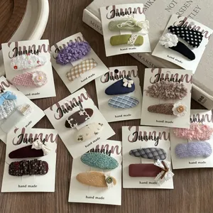 Colorful handmade fabric hair clip set for girls with knit patterns and floral accents