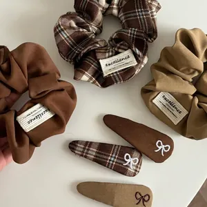 Vintage brown plaid hair scrunchie set with embroidered bow clips and excellence patches