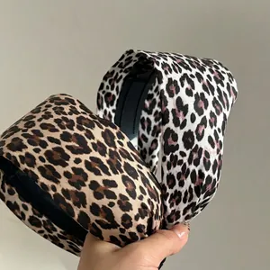 Fashionable wide leopard print headbands in brown and pink for a high cranial top look