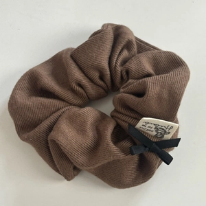 Vintage brown ribbed knit scrunchie with black bow and handmade cloth label for women