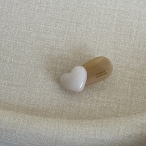 Minimalist handmade heart hair clip in brown and cream resin for side bangs