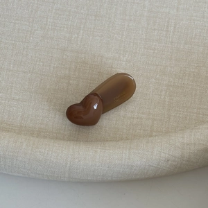 Brown heart-shaped acetate hair clip with amber base in minimalist Morandi style