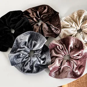 Five-piece set of large French velvet scrunchies in neutral colors with wavy pleats