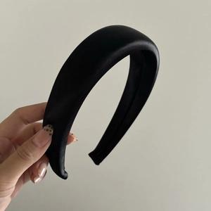 Elegant thick black satin headband with a glossy finish for a stylish hairstyle