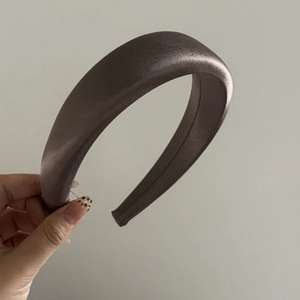 Detail view of thickened dark brown satin headband with premium glossy fabric finish