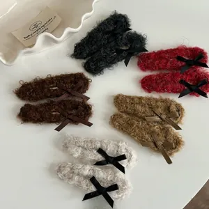 Set of ten plush lamb wool hair clips with delicate ribbon bows in five neutral colors