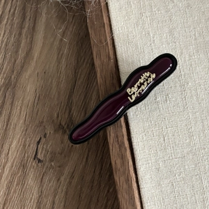 Elegant burgundy acetate hair clip with golden Barrette La France text and black edges