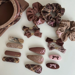 Pink and brown plaid hair accessory set including headbands and scrunchies with embroidery