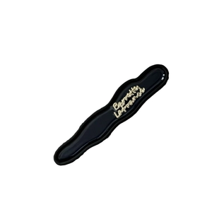 Elegant black wavy acetate hair clip with gold Barrette La France lettering