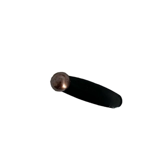 Minimalist dark brown leather hair clip with a vintage bronze sphere detail on white background