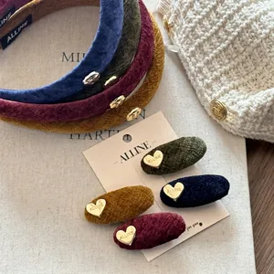 Vintage velvet headbands and heart clips in navy, green, red, and yellow on a display card