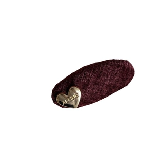 Elegant burgundy velvet hair clip with a golden vintage metal heart charm and engraving