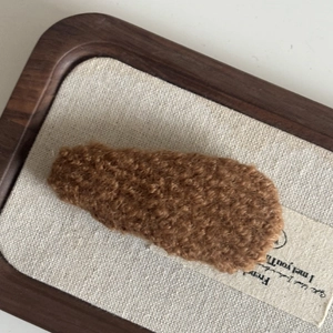 Minimalist brown faux shearling BB hair clip with plush texture and water drop shape